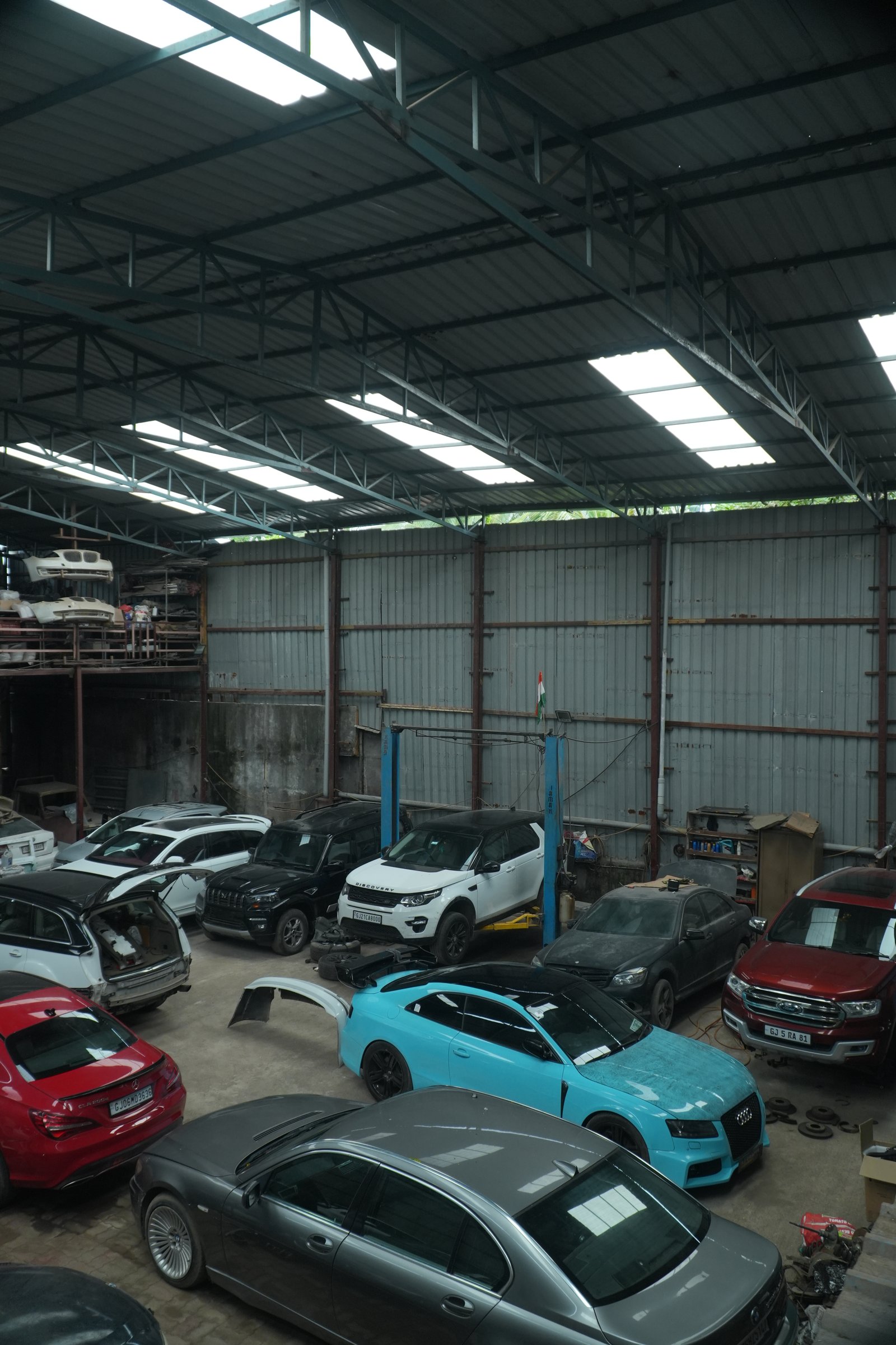 SJ Crafts garage interior with tool chests and polished floors